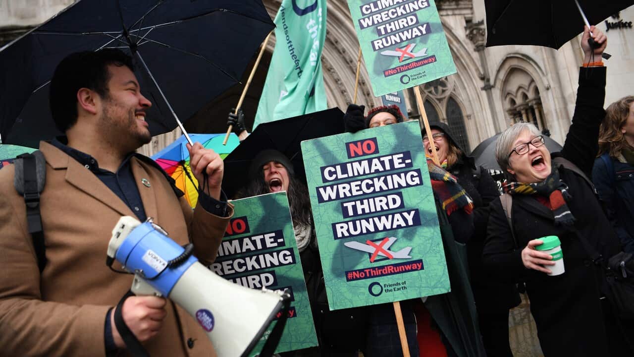 Environmental campaigners celebrate outside the High Court in London, Britain, 27 February 2020
