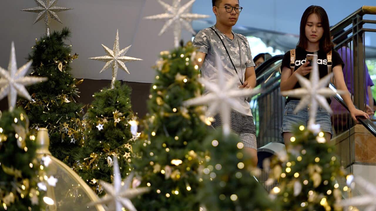 Shoppers are seen at Pitt Street Mall