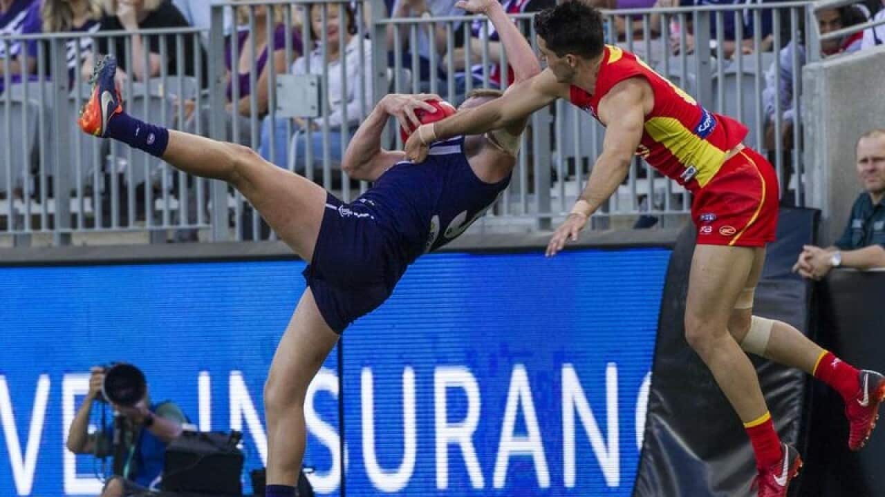 Players fall onto an LED sign.