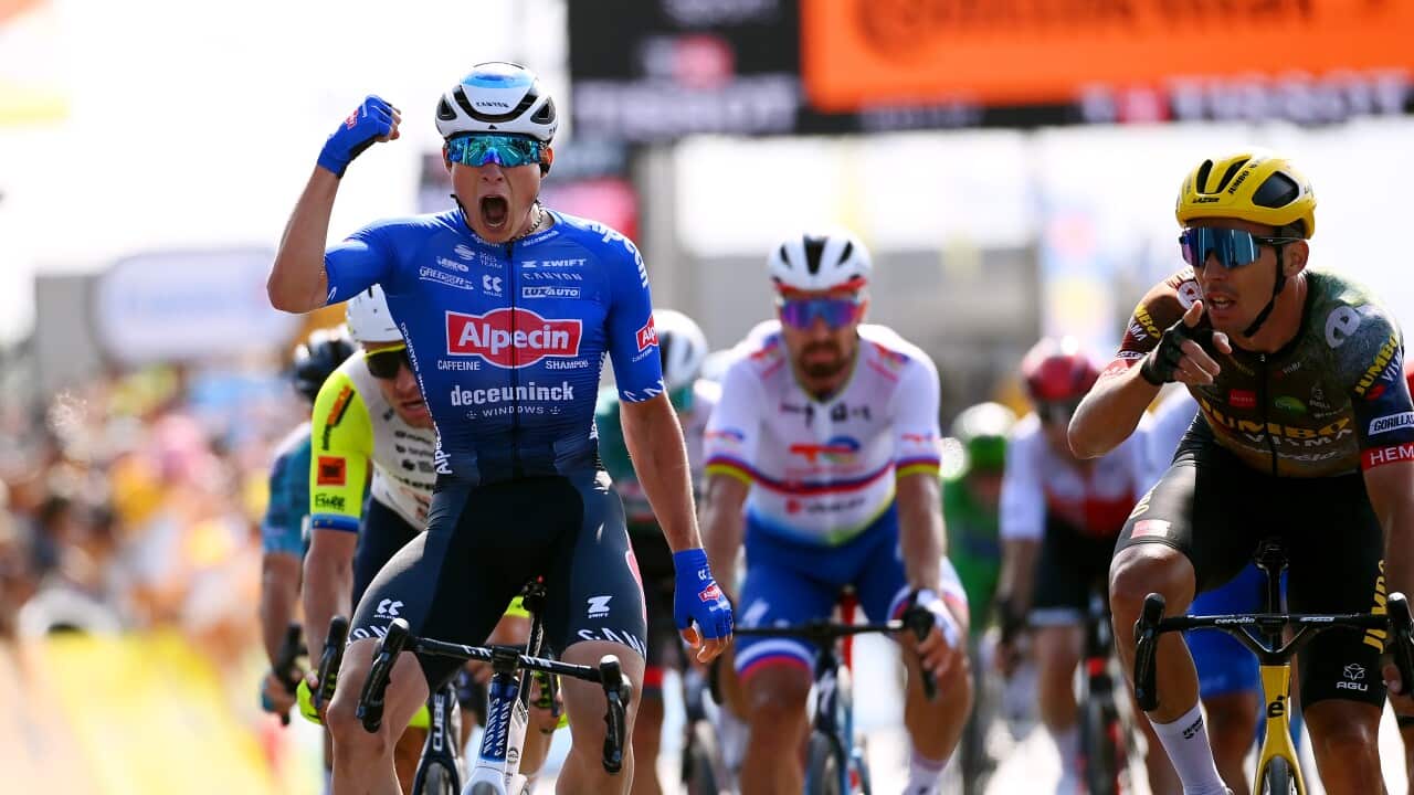Jasper Philipsen mistakenly celebrates after finishing second on Stage 4 of the Tour de France.