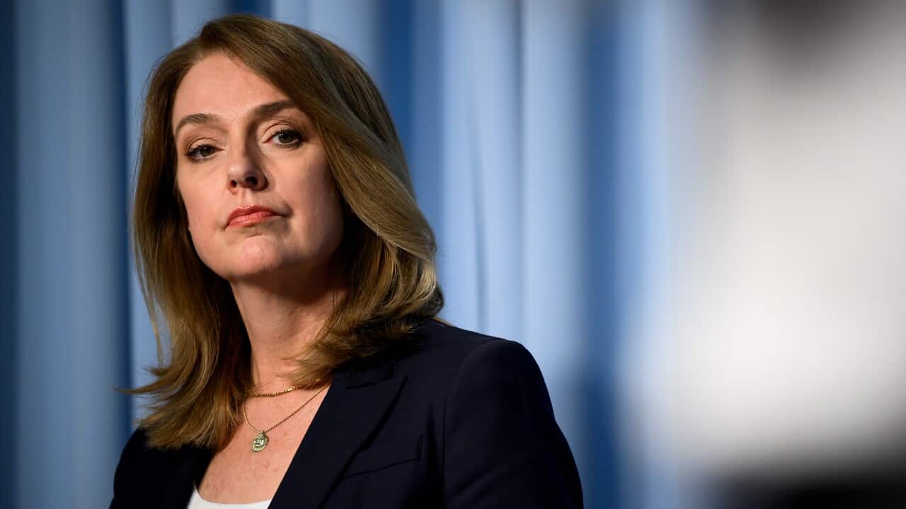 A middle-aged white woman with light brown hair