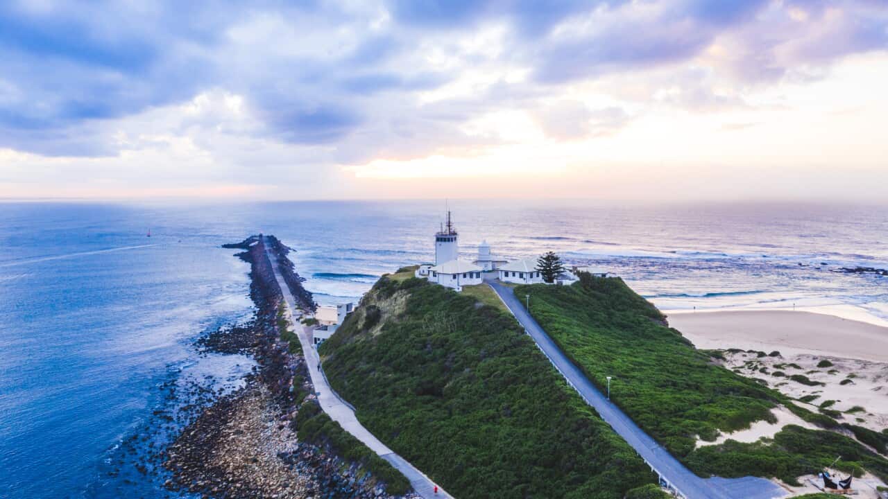 Aerial of Newcastle and Nobby's Lighthouse in Newcastle Harbour, New South Wales, Australia