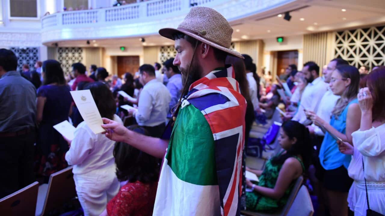 Australian citizenship recipients and their guests attend a citizenship ceremony on Australia Day in Brisbane, Thursday, Jan. 26, 2017. (AAP Image/Dan Peled) NO ARCHIVING