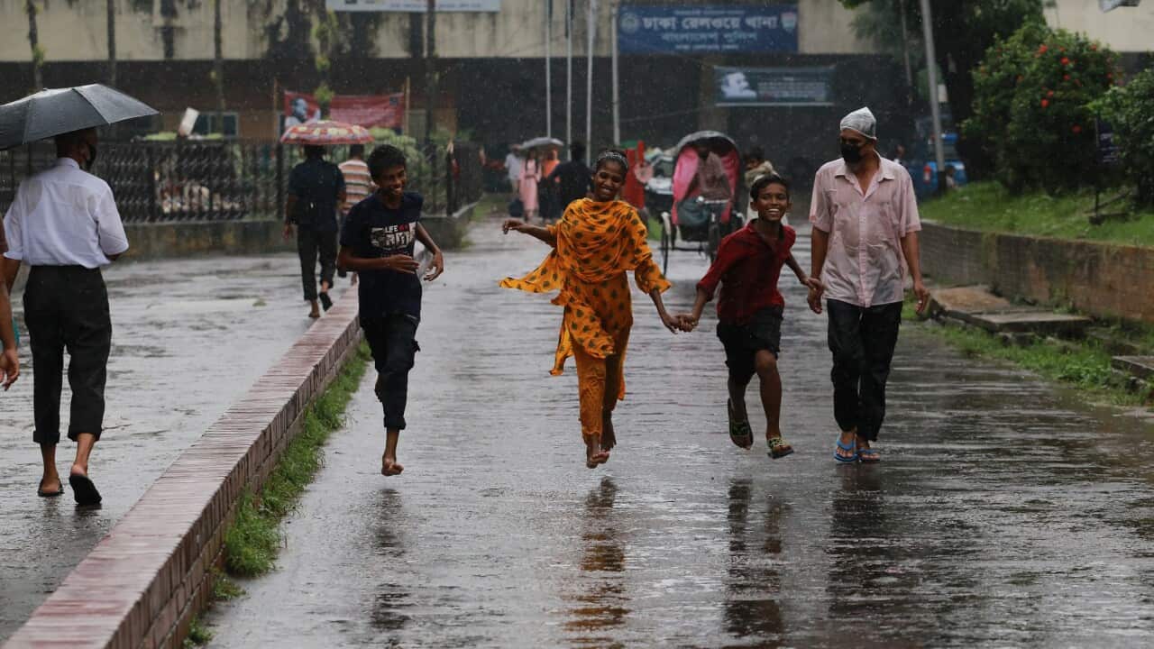 Children in the rain in Dhaka, Bangladesh
