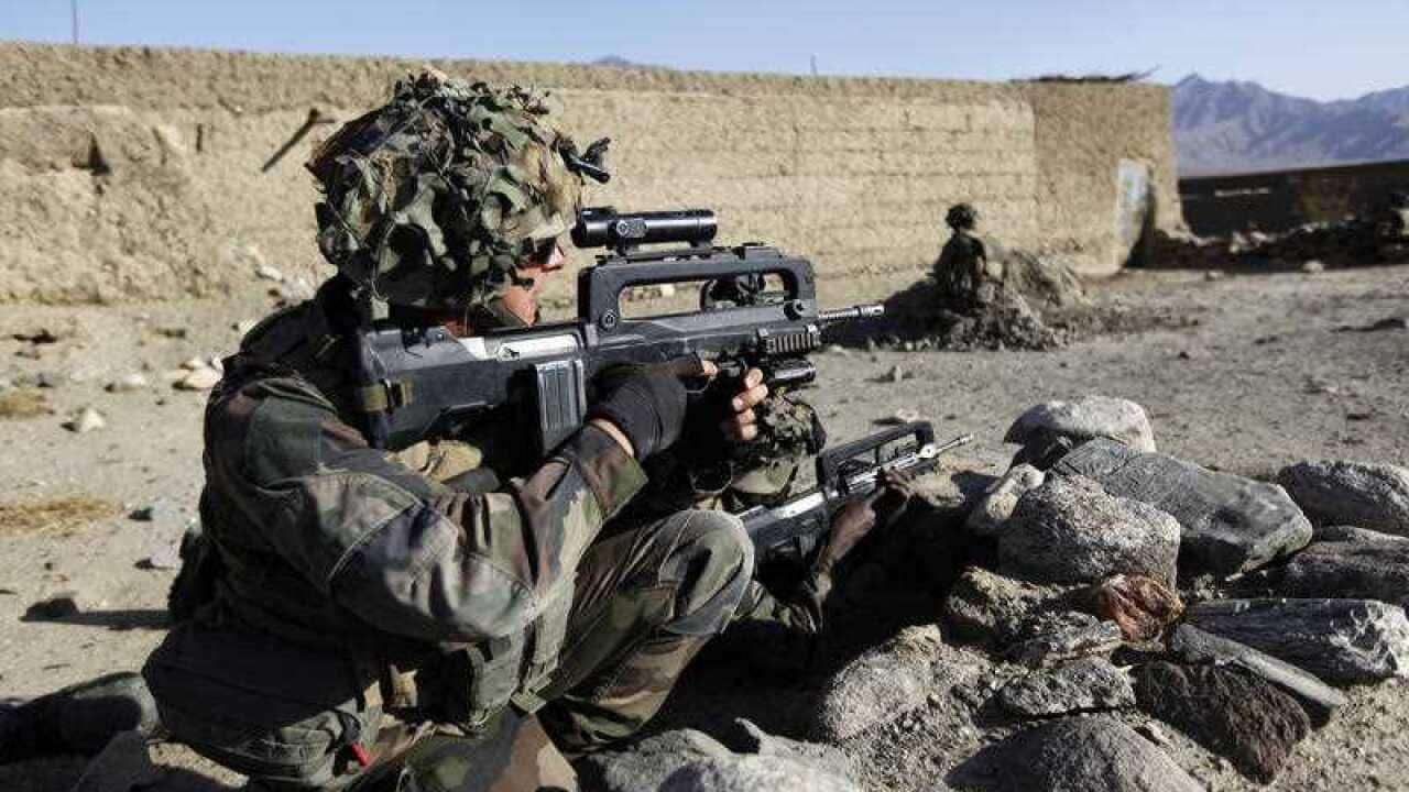 France says it will keep troops in Syria to combat IS. A Foreign Legion trooper is pictured fighting in Afghanistan.