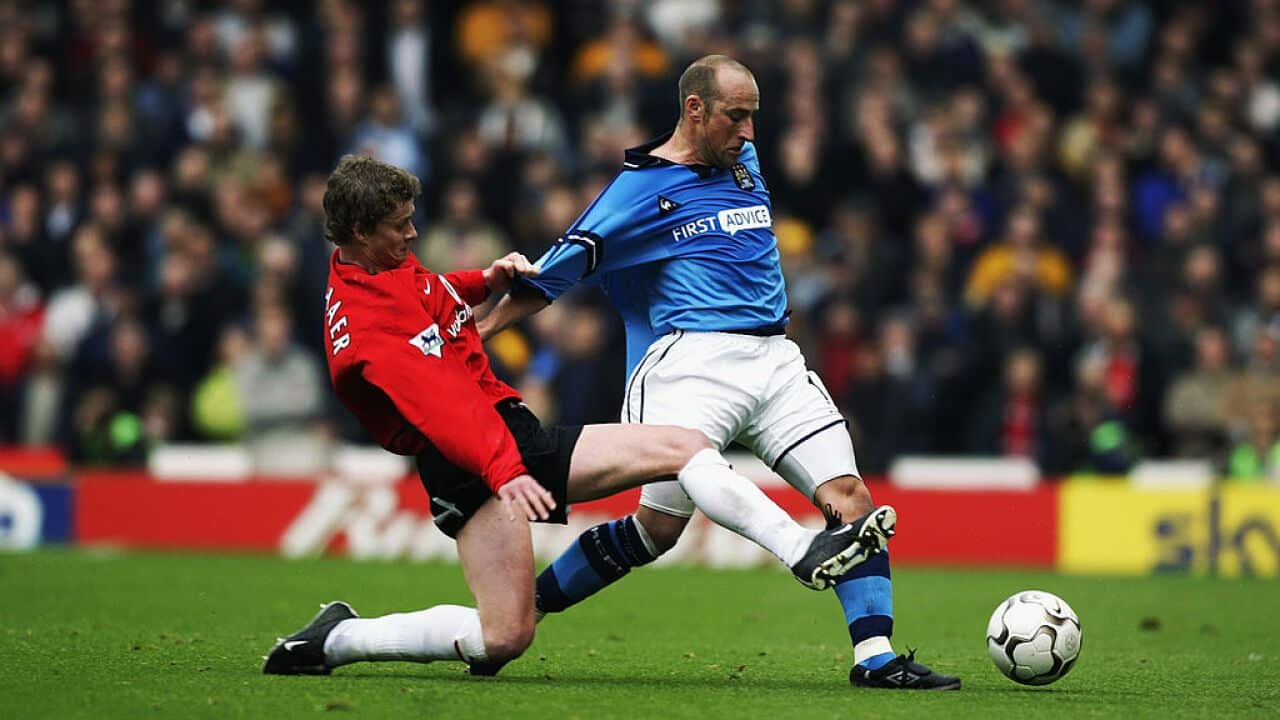 Danny Tiatto of Manchester City and Ole Gunnar Solskjaer of Manchester United