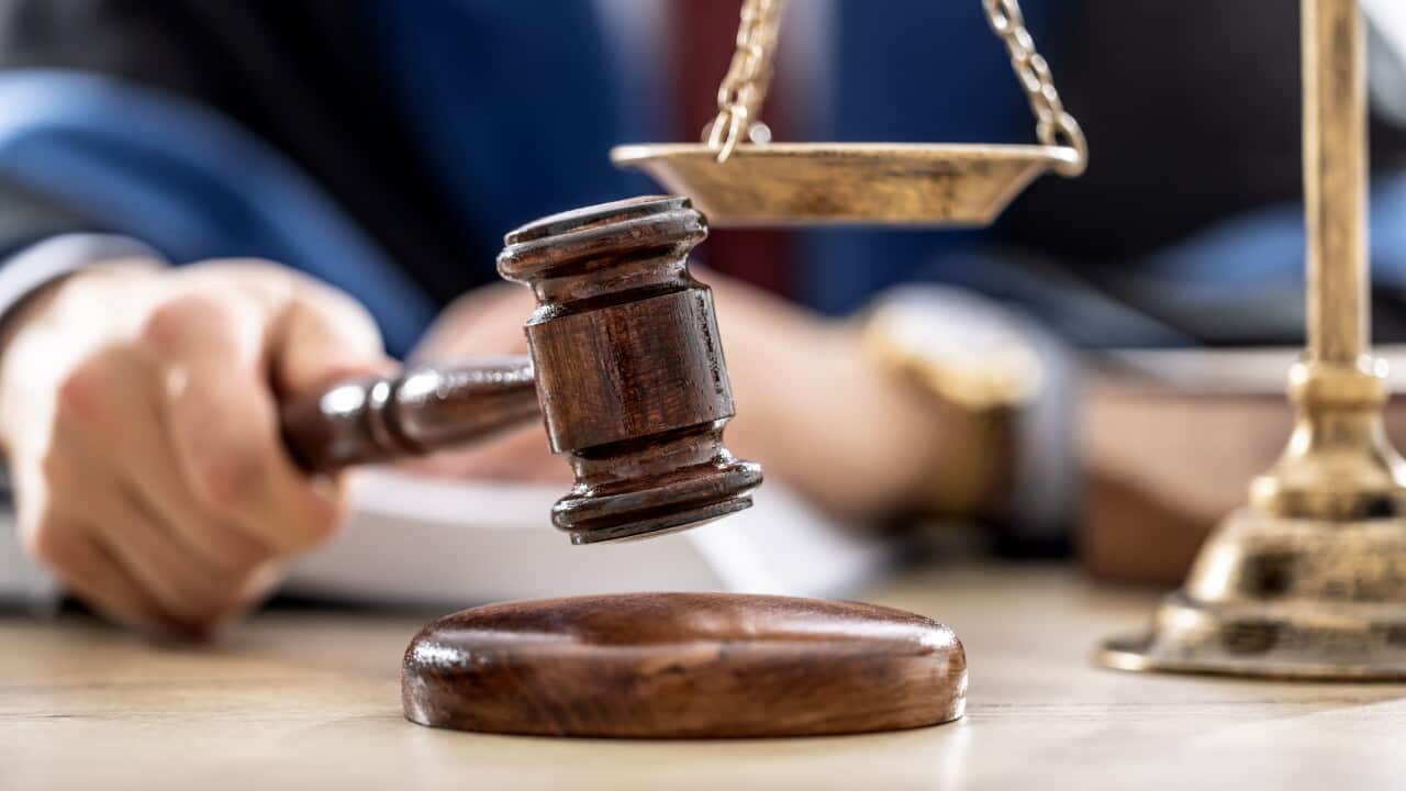 Symbols of law a legal system - a judge, gavel and scales representing jurisdiction.