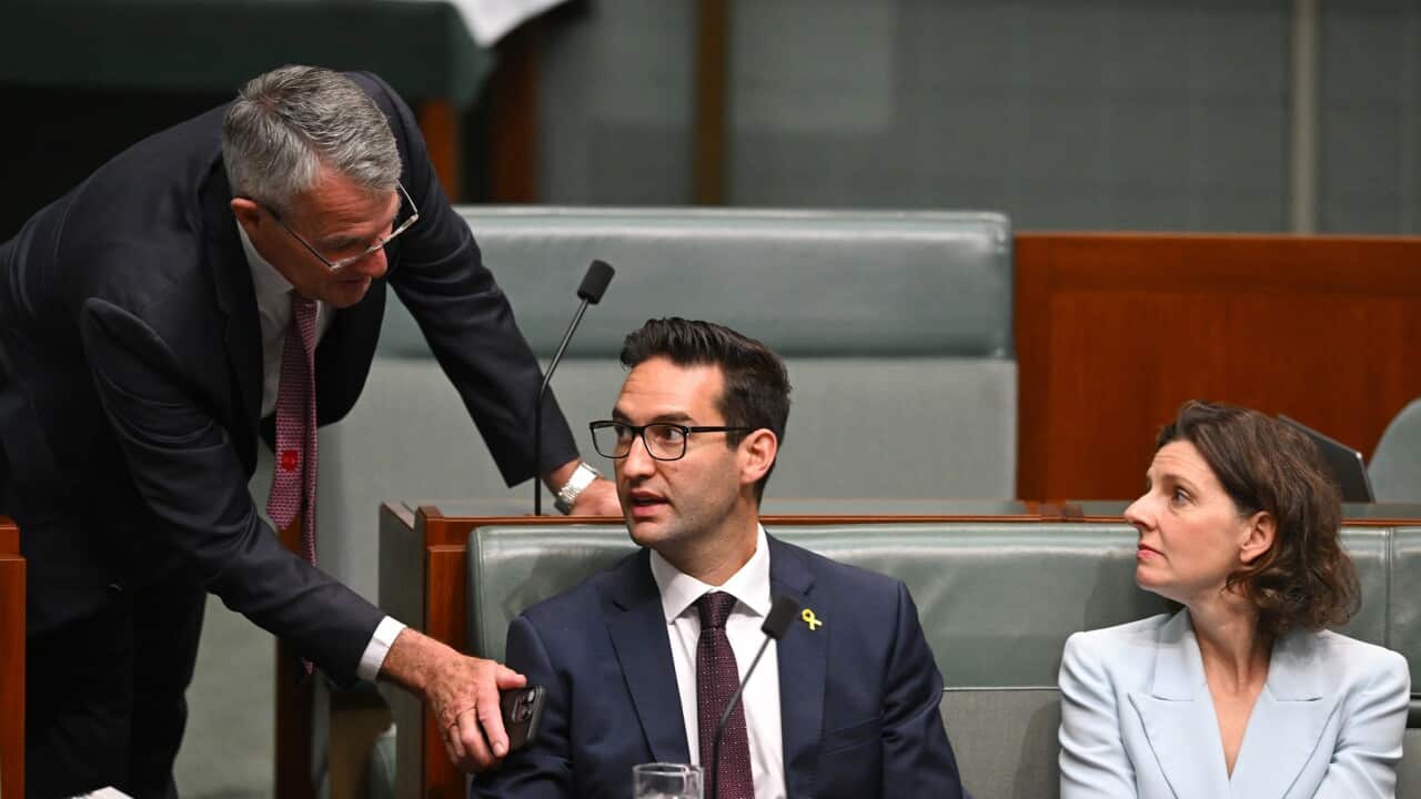 Attorney-General Mark Dreyfus speaks to Independent MP Allegra Spender and Labor MP Josh Burns during the motion on antisemitism (AAP).