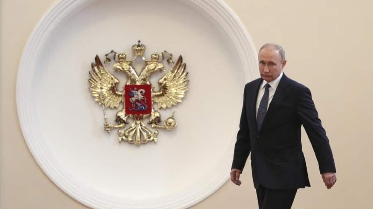Vladimir Putin enters to take the oath during his inauguration.