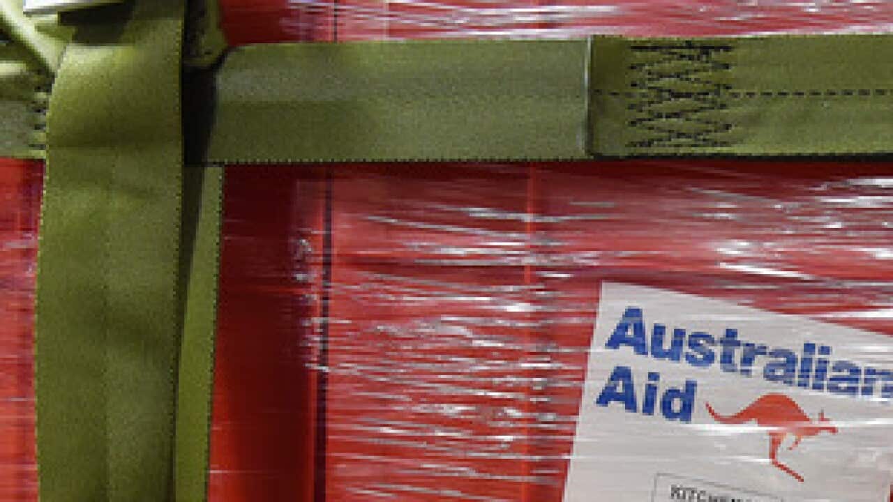 Aid is seen onboard an Australian RAAF