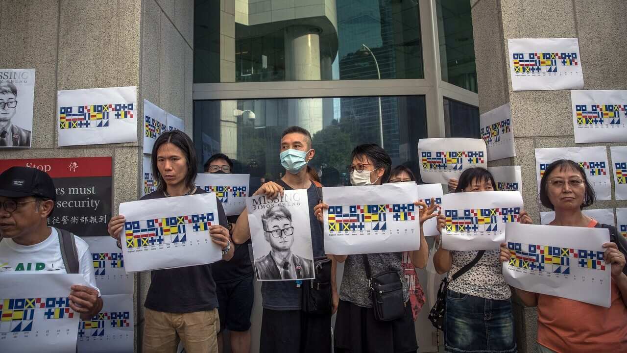 Activists attend a rally in support of Simon Cheng in Hong Kong - AAP