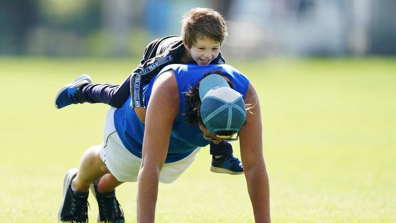 A father trains with his son in Melbourne