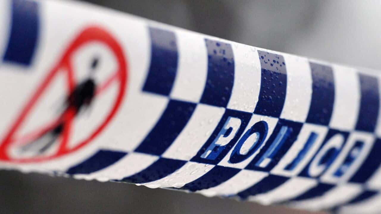 Police tape restricts access to a crime scene