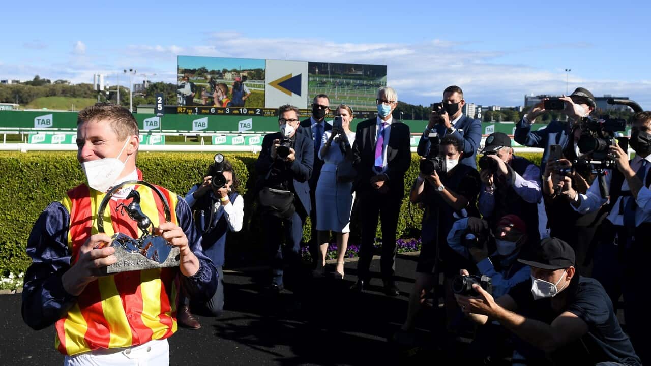 Jockey James McDonald lifts the Everest jockey’s trophy after riding Nature Strip to victory in race 7, The Everest, at Royal Randwick Racecourse in Sydney, Saturday, October 16, 2021. (AAP Image/Dan Himbrechts) NO ARCHIVING, EDITORIAL USE ONLY