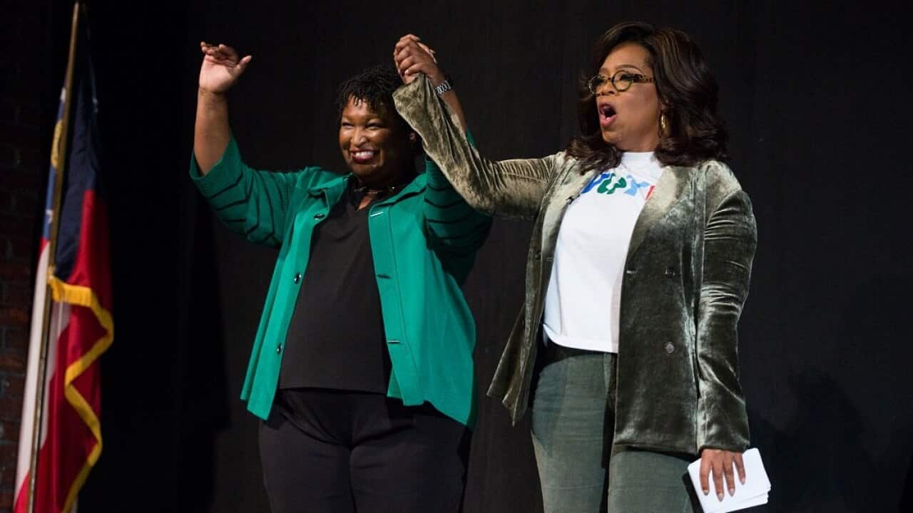 Oprah Winfrey and Stacey Abrams