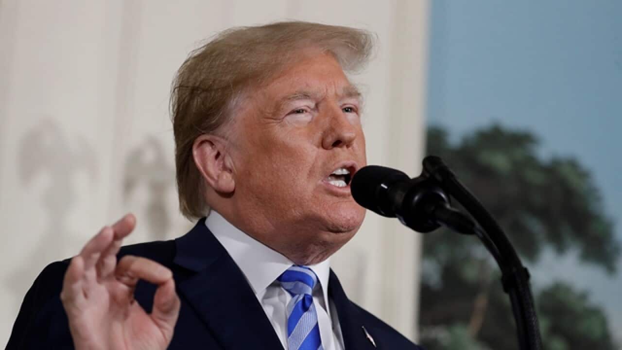 President Donald Trump delivers a statement on the Iran nuclear deal from the Diplomatic Reception Room of the White House, Tuesday, May 8, 2018, in Washington. 