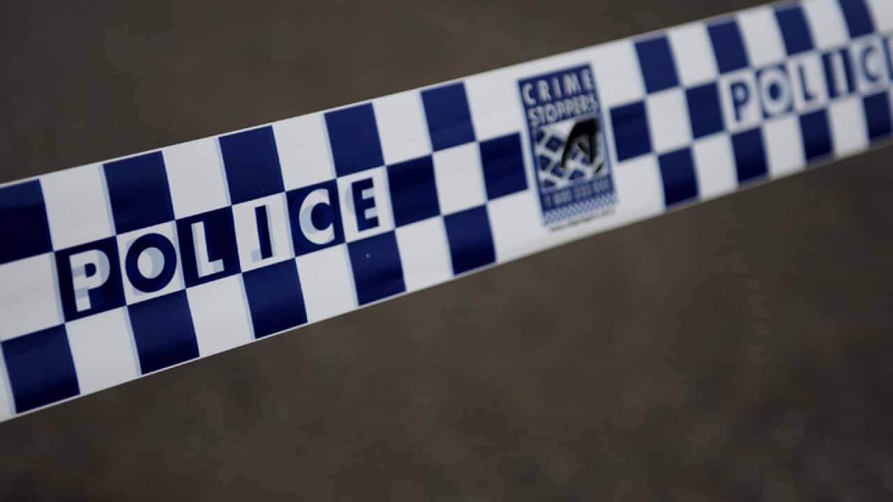 Police tape restricts access to a street in Sydney