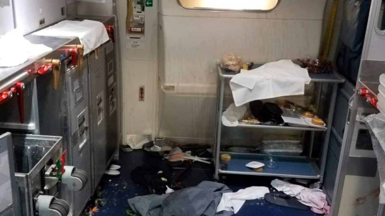 This Friday, July 7, 2017 photo taken the FBI and released via the U.S. Attorney's Office in Seattle shows the aftermath of a cabin on Delta Flight 129