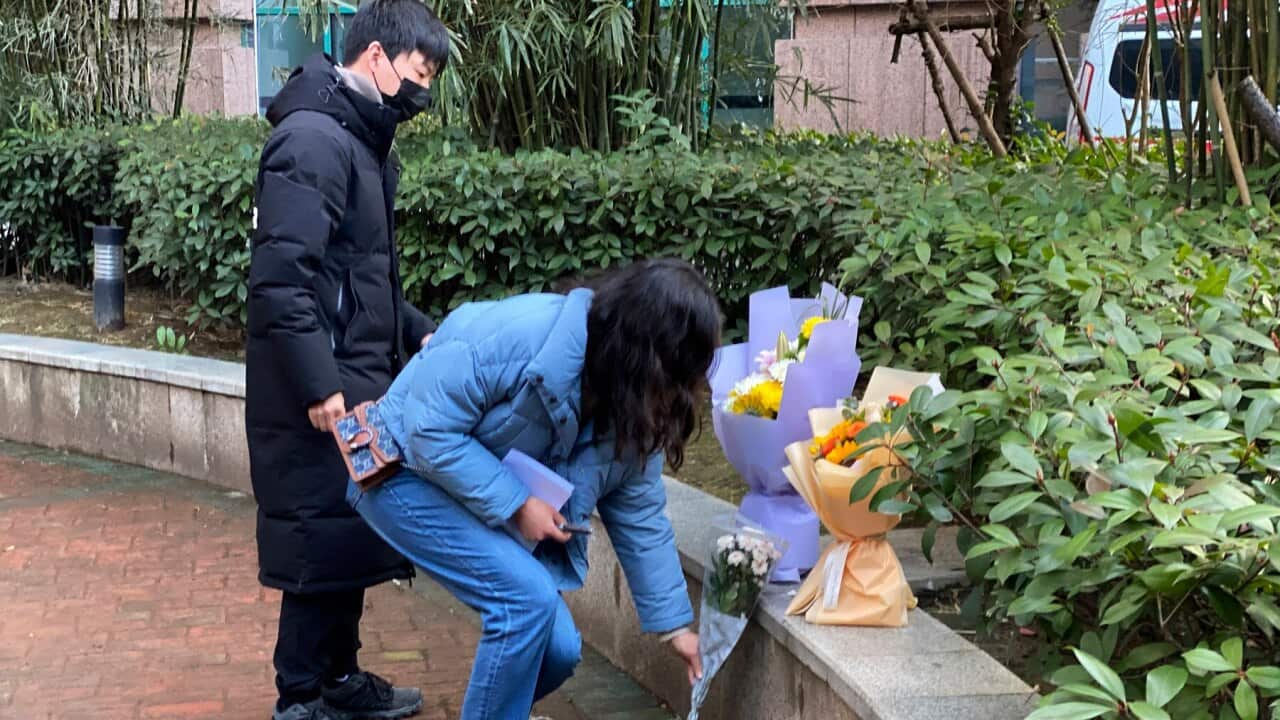 Residents visiting the Wuhan Central Hospital offer flowers in memory of whistleblower Li Wenliang