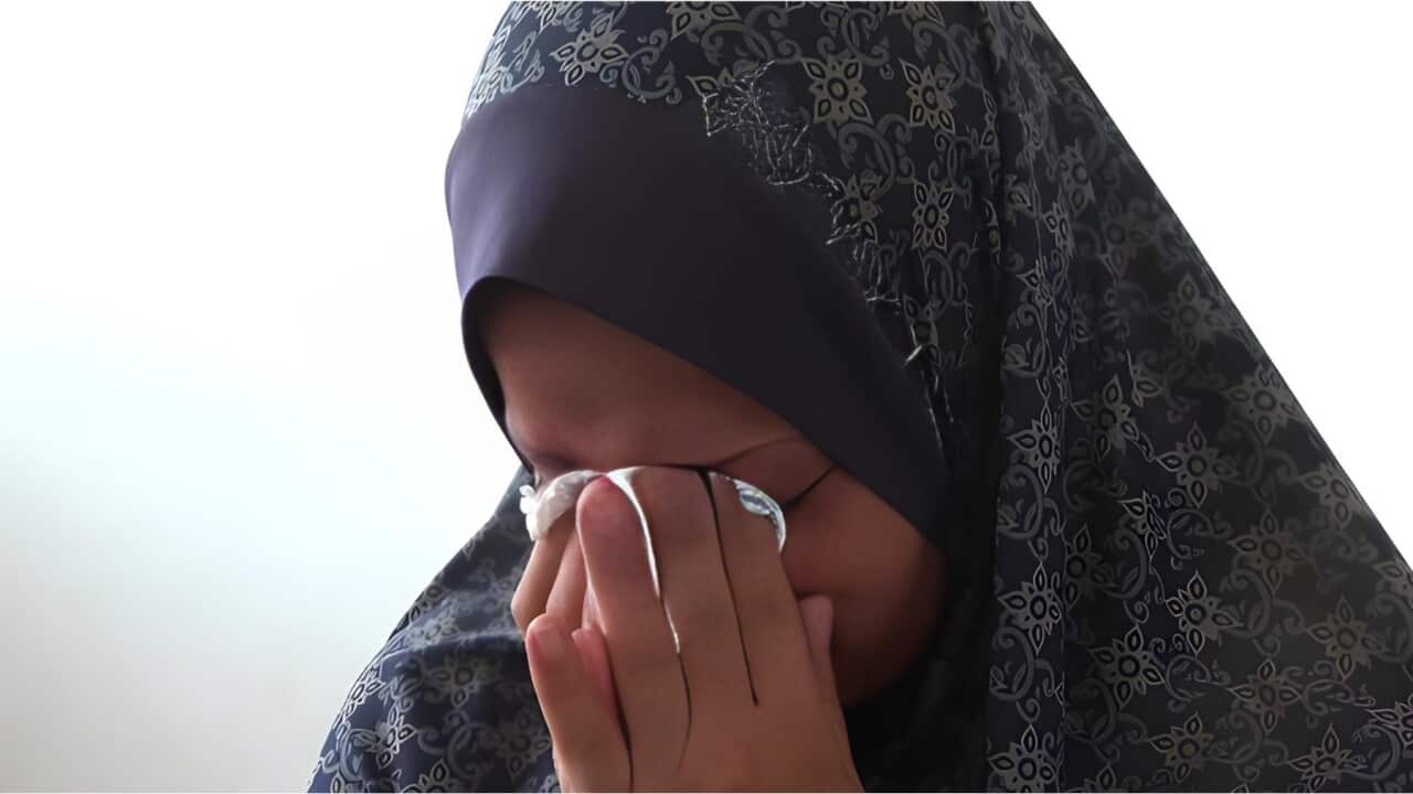 Nabila Hamada had to leave one of her twin babies behind.