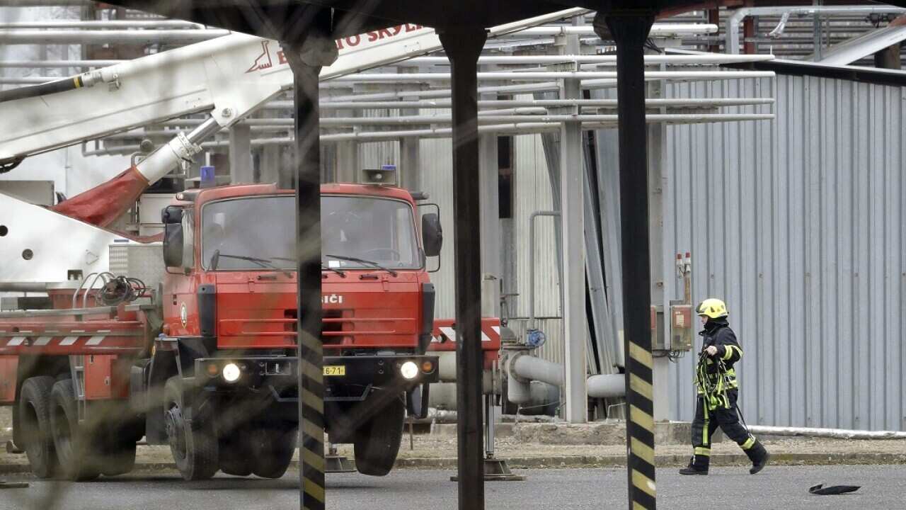 A firefighter walks at the site of an explosion in a chemical plant in Kralupy-nad-Vltavou, Czech Republic.