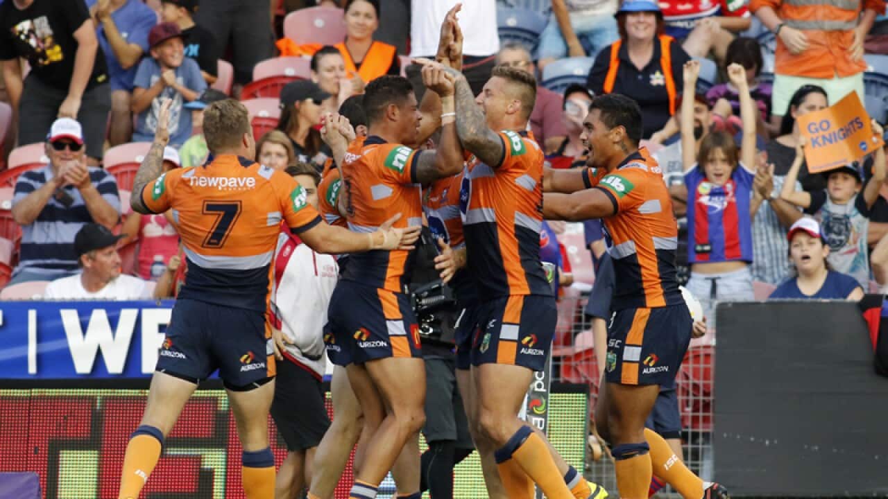 Newcastle Knights players celebrate
