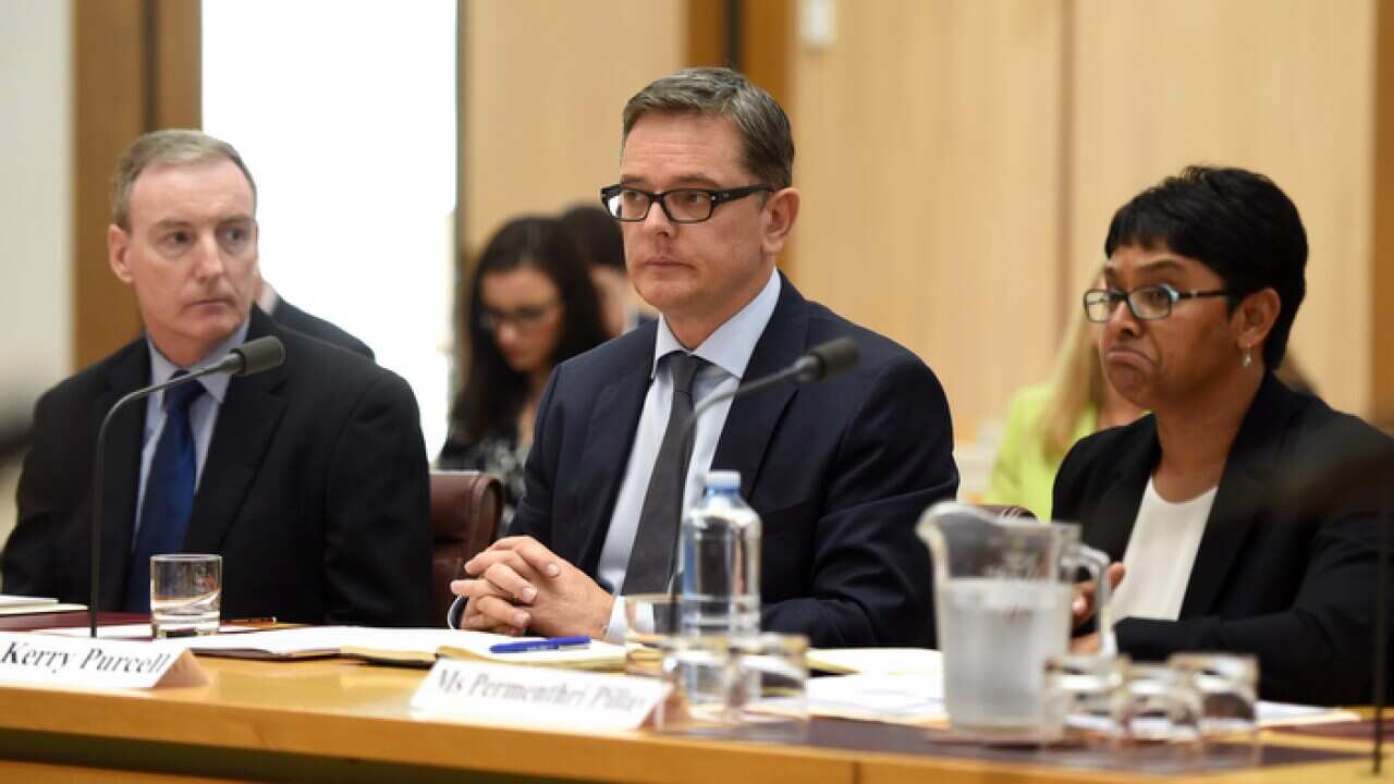 IBM Australia Managing Director Kerry Purcell (centre) speaks during a Senate Estimates hearing into the Census at Parliament House in Canberra, Tuesday, Oct. 25, 2016. (AAP Image/Lukas Coch) NO ARCHIVING