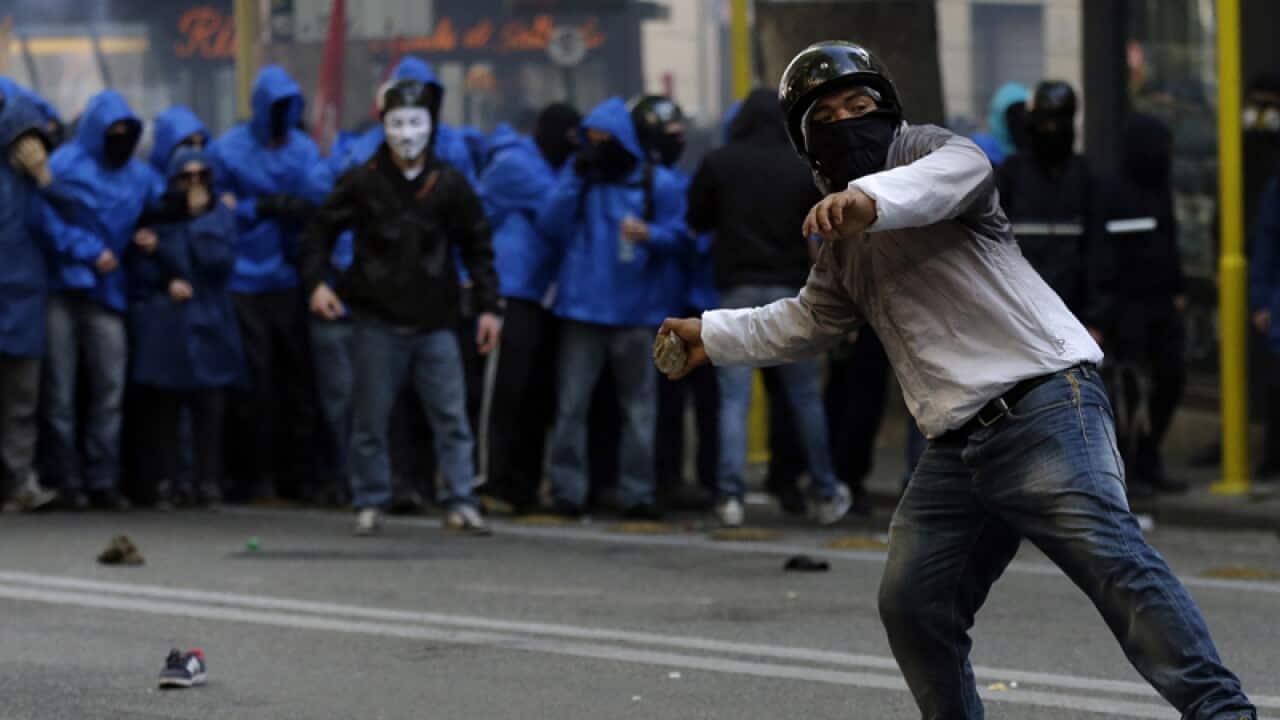 Demonstrators clash with police during an anti-austerity protest, Rome