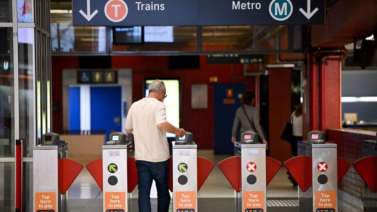 Commuters are seen at Martin Place train station in Sydney
