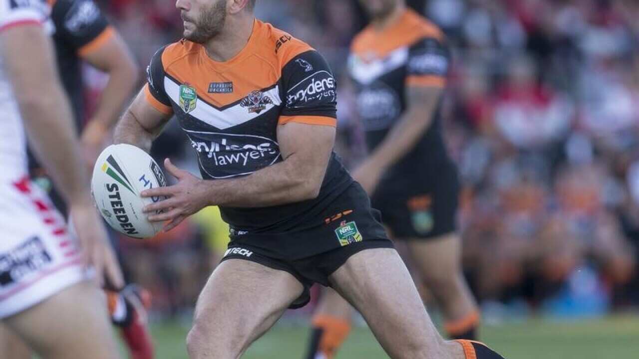 Robbie Farah of the Tigers in action against the Dragons.