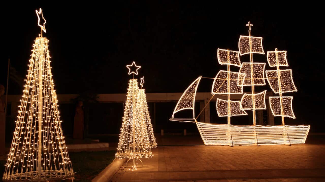 Christmas ship and trees at night
