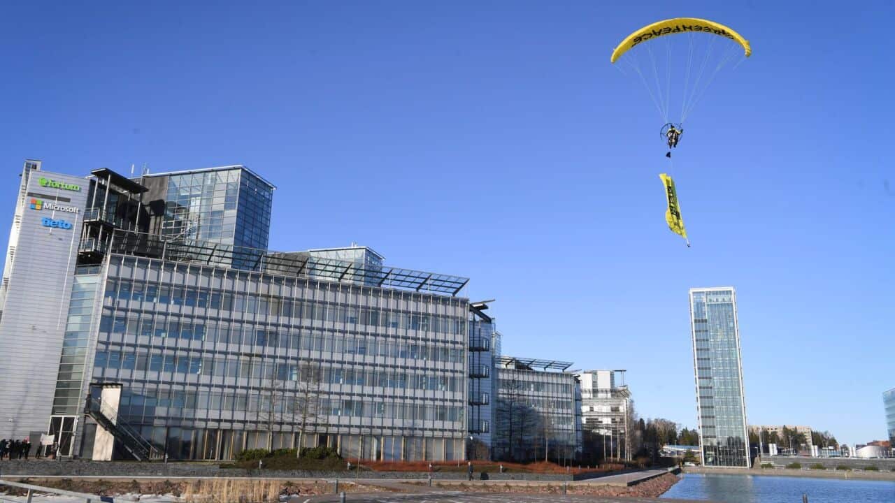Greenpeace activists protest outside the Fortum headquarters in Espoo, Finland