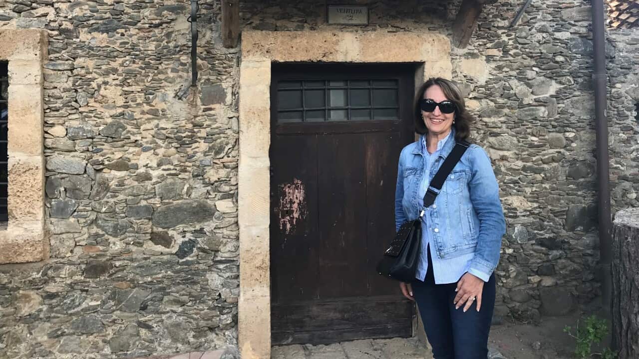 Giovanna Cardamone in front of the house where she was born in Italy.