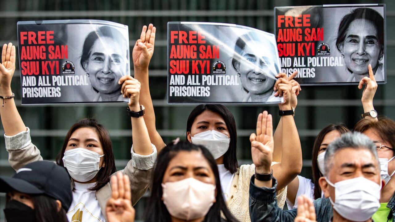 A group of Myanmar activists hold up placards calling for the release of their ousted leader Aung San Suu Kyi