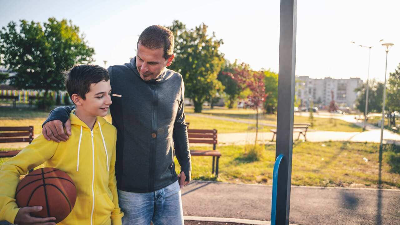 Morning Training. Father And Son Playing Basketball. Conversation between father and a son