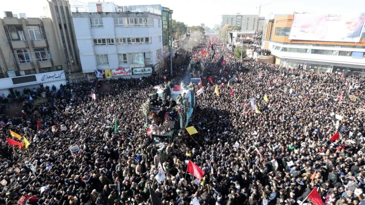 Iranians carrying the coffin of Qasem Soleimani in his home town Kerman, Iran (AAP).
