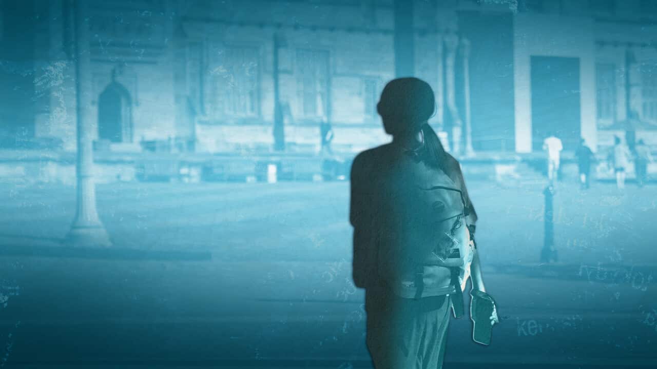 The silhouette of a university student against the backdrop of a university, with a blue wash over the image.