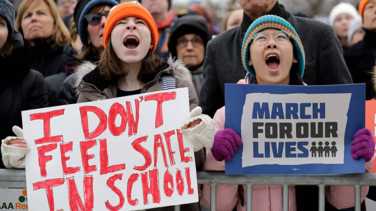 Demonstrators attend a "March for Our Lives" rally in support of gun control, Saturday, March 24, 2018, in Chicago.