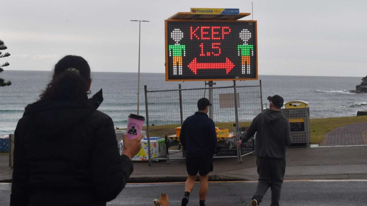 A Covid warning sign is seen at Bondi Beach in Sydney, Friday, July 23, 2021