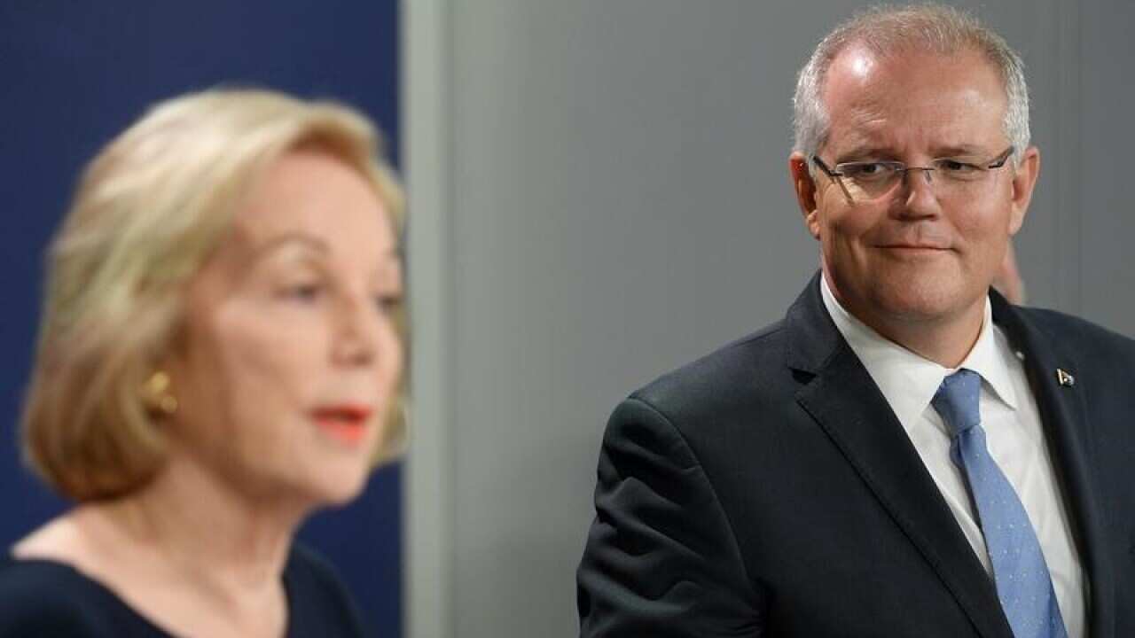 ABC Chair Ita Buttrose (L) and Prime Minister Scott Morrison are expected to meet soon. The ABC boss is now considering legal action.