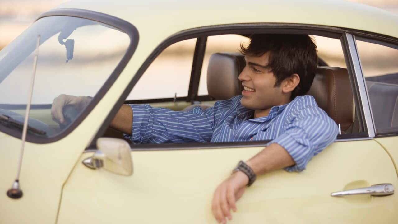 Young man sitting in a car