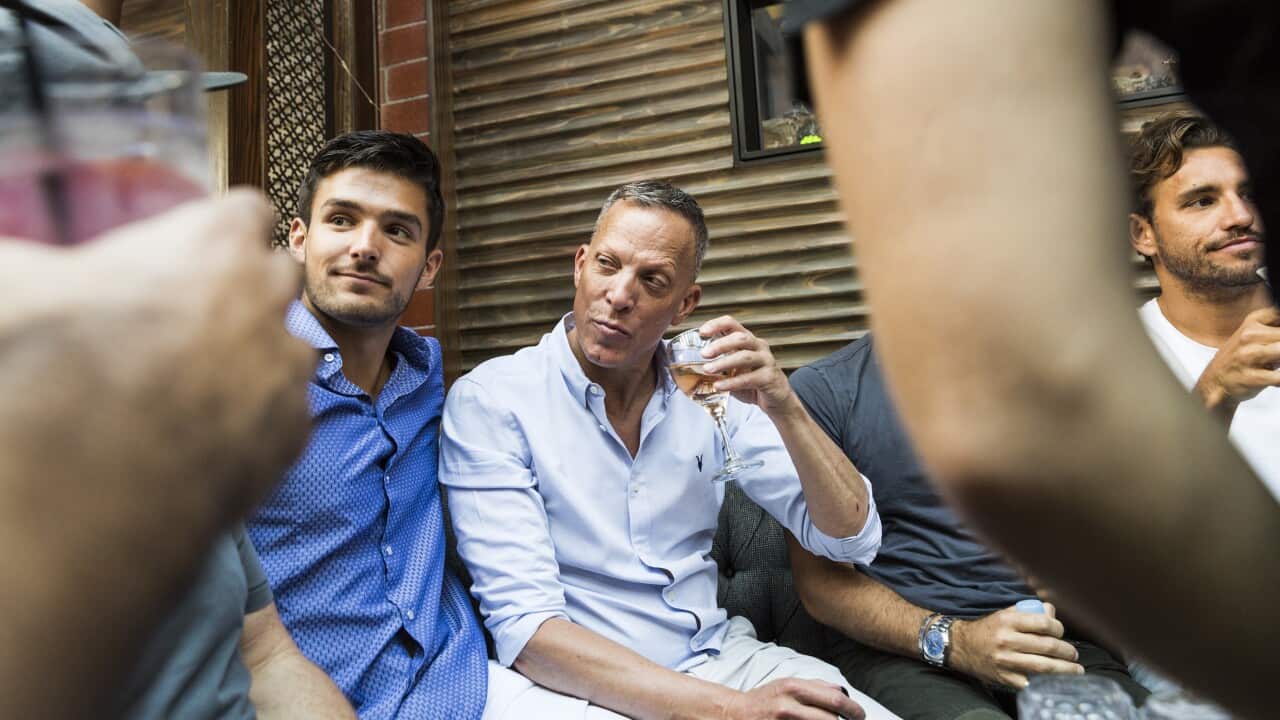 David Cooley, center, the owner of The Abbey, a popular gay bar in West Hollywood, hangs out with friends at The Chapel at the Abbey, in Los Angeles.