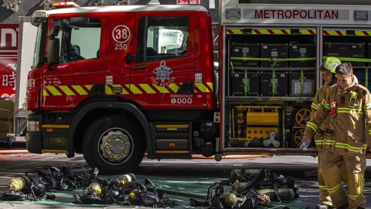 Firefighters are seen at the site of a restaurant fire in Melbourne.