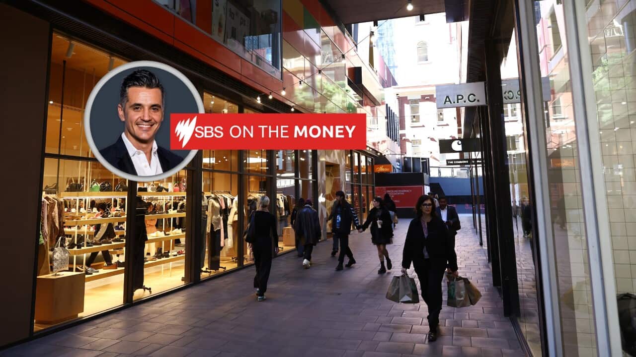 Shoppers walk past clothing stores in the CBD.