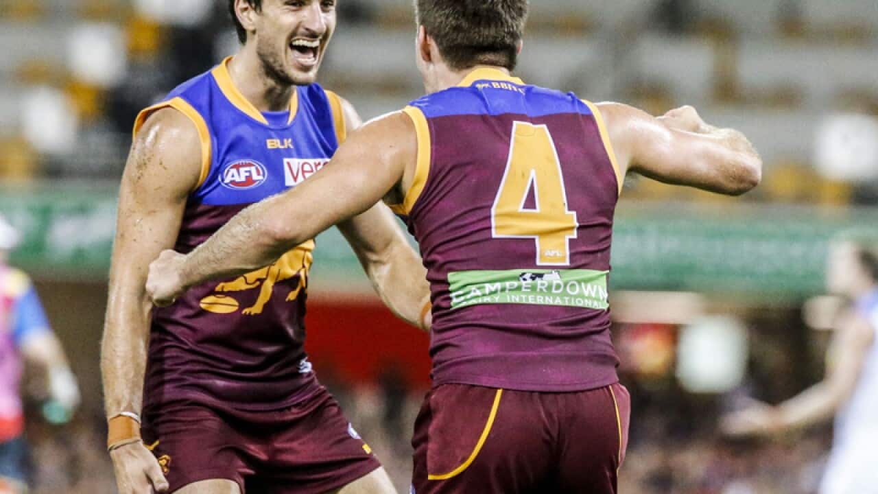 Ryan Bastinac of the Lions celebrates with team mates
