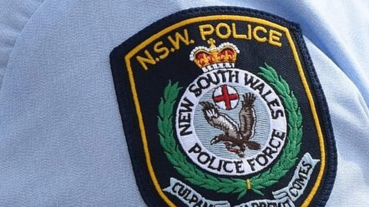 Stock image of New South Wales Police badges in Sydney, Friday, Aug. 16, 2013. (AAP Image/Dean Lewins) NO ARCHIVING