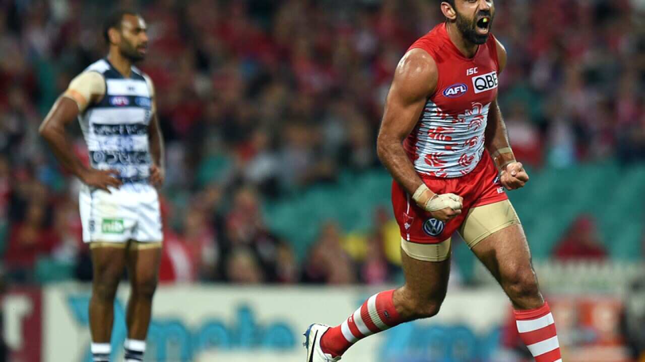 Adam Goodes celebrates kicking a goal against the Geelong.