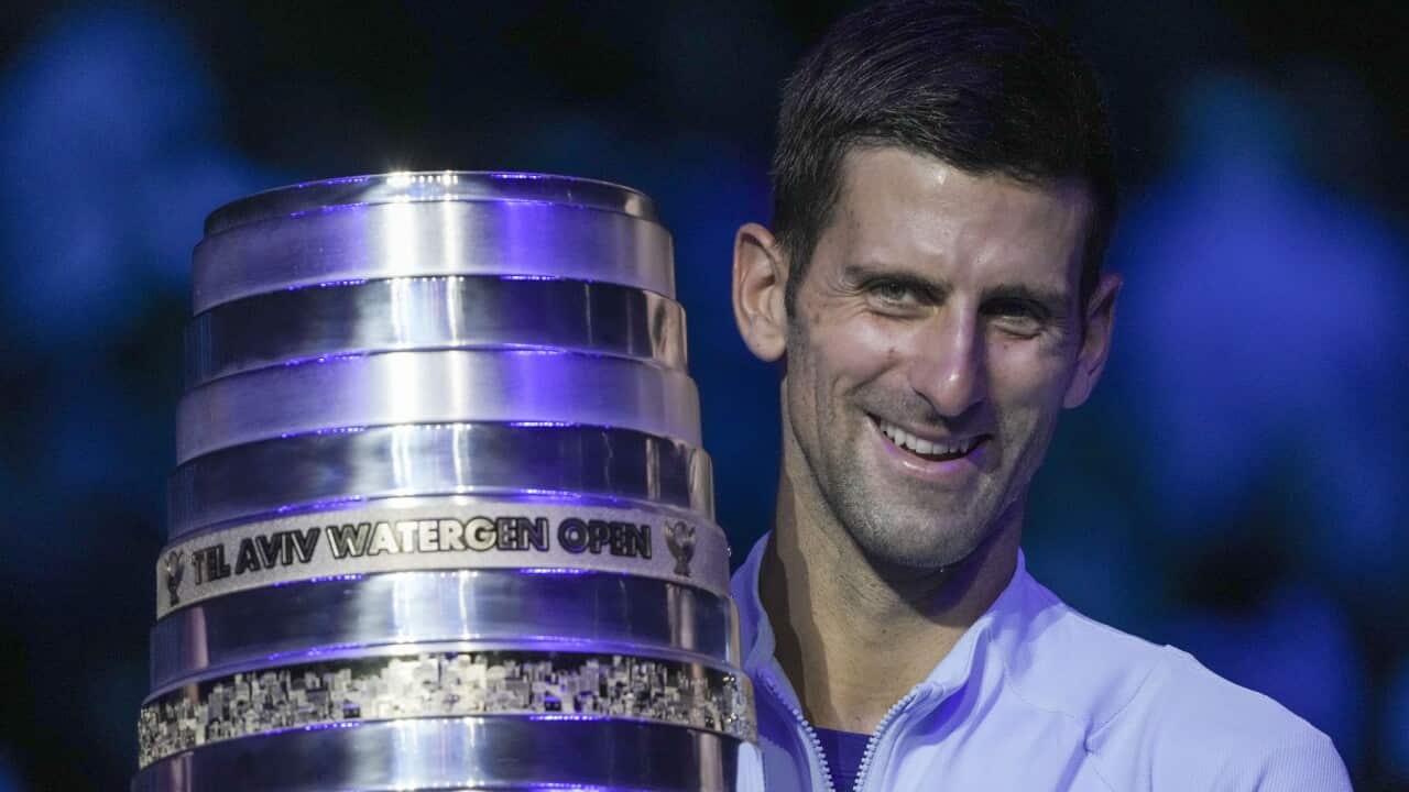 Serbia's Novak Djokovic poses with the trophy after winning the final tennis match of the ATP 250 Tel Aviv open against Croatia's Marin Cilic in Tel Aviv