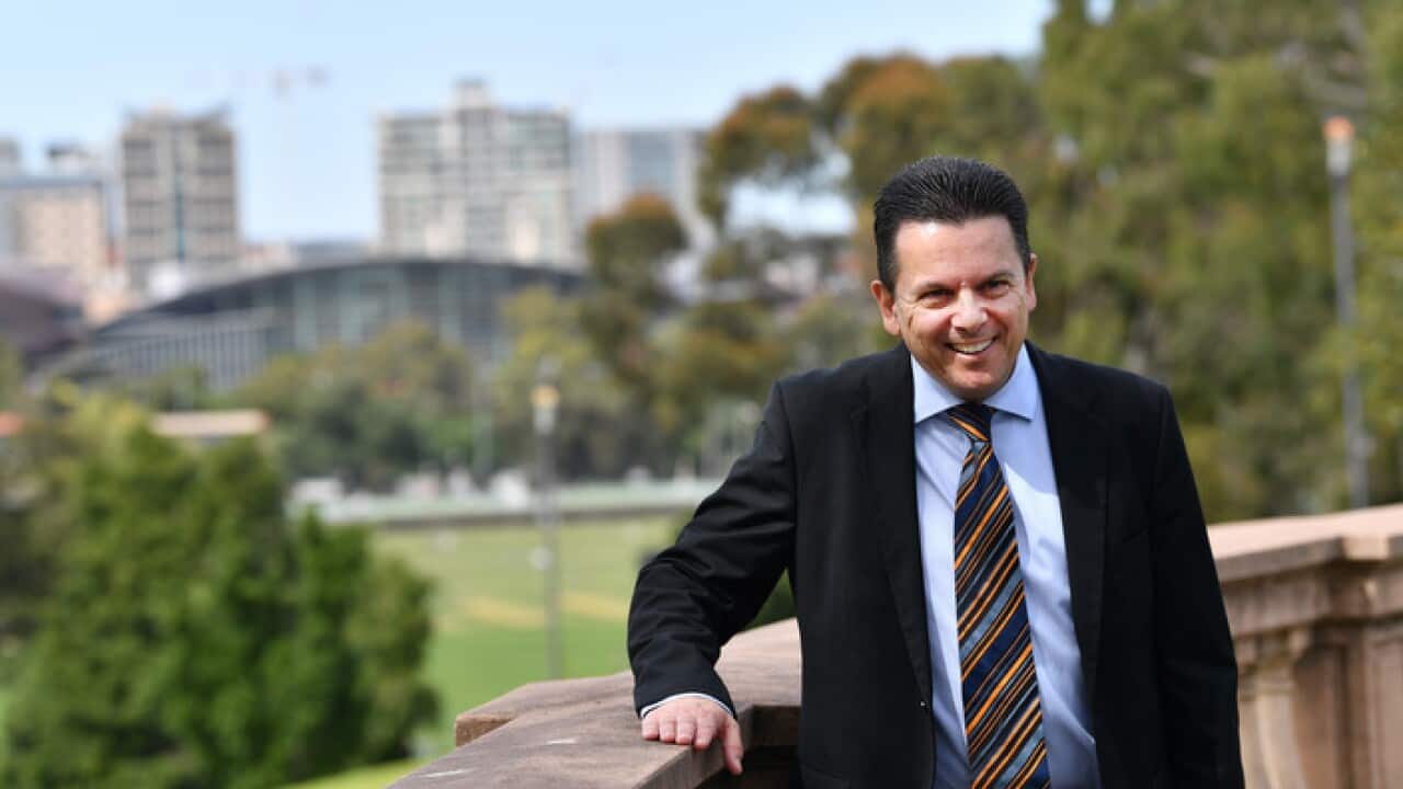 Senator Nick Xenophon poses for a photo after his announcement to the media in Adelaide