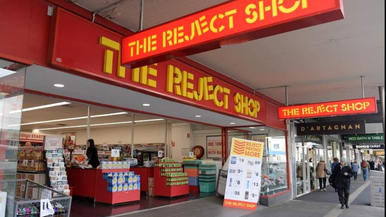 A The Reject Shop store front and people walking on pavement
